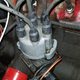 The rotor under the cap is pointed towards the rightmost spark plug wire (that goes to cylinder one)